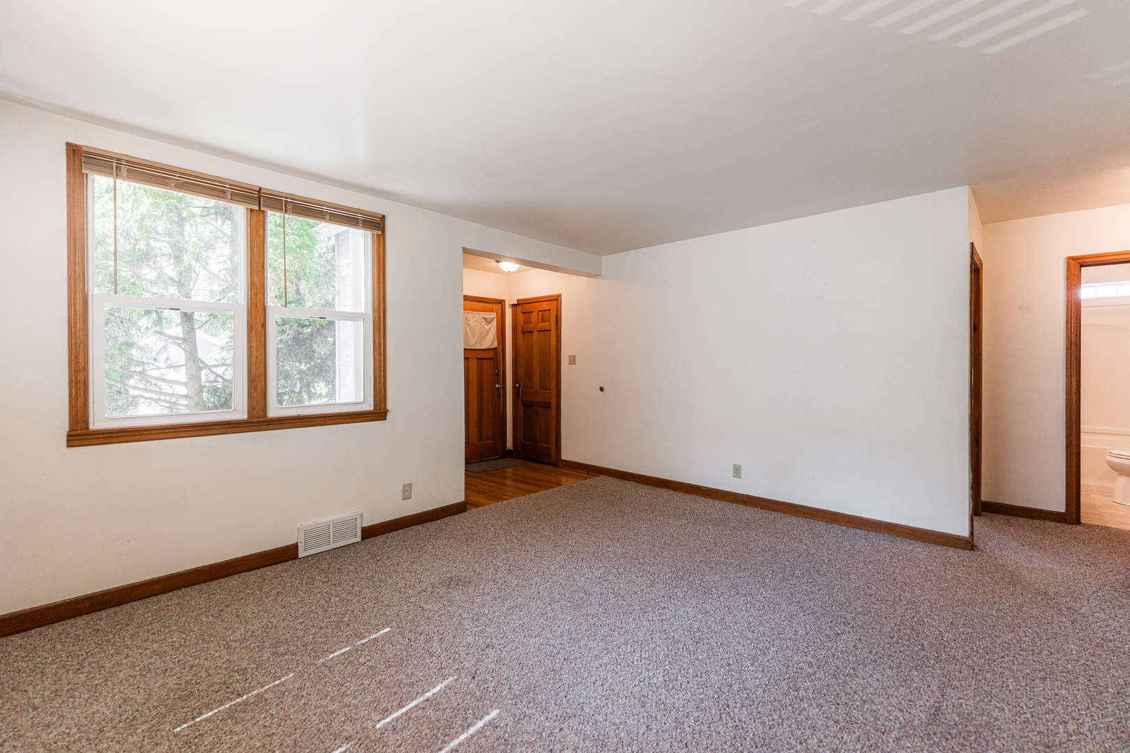 512 North 6th Street, Unit 1 DeKalb, IL 60115 - Photo 3 of 15 a view of an empty room with a window