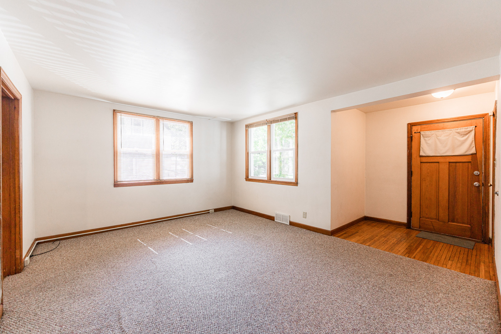 512 North 6th Street, Unit 1 DeKalb, IL 60115 - Photo 4 of 15 an empty room with windows