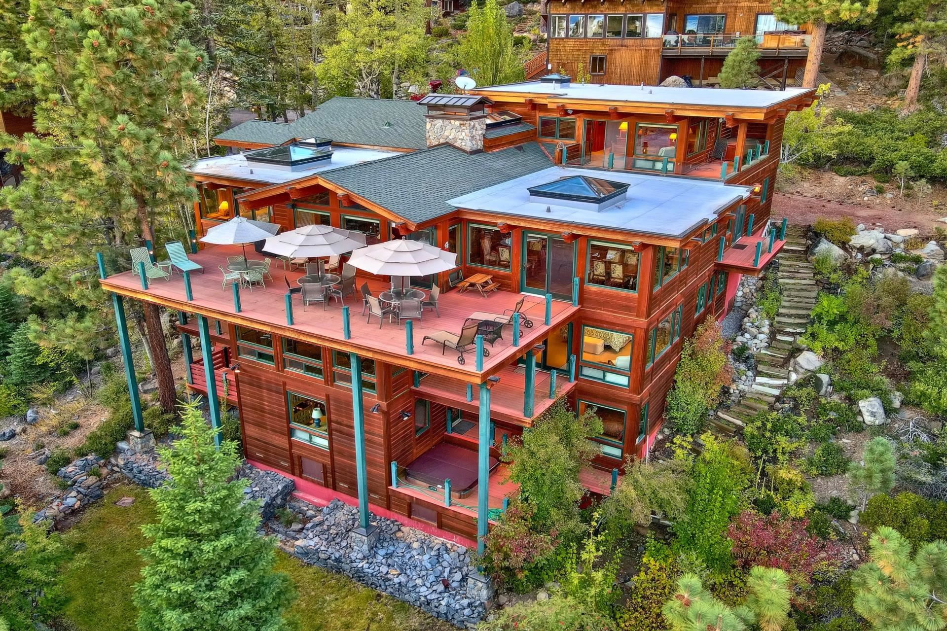 aerial view of a house with roof deck front of house