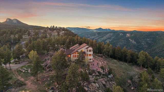 a view of house with mountain view