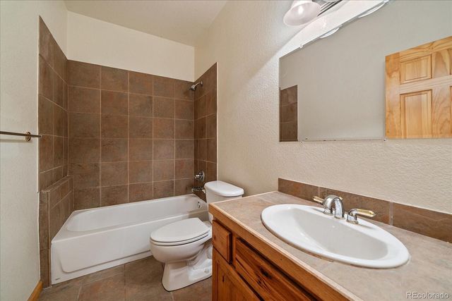 a view of a city with mountains in the background