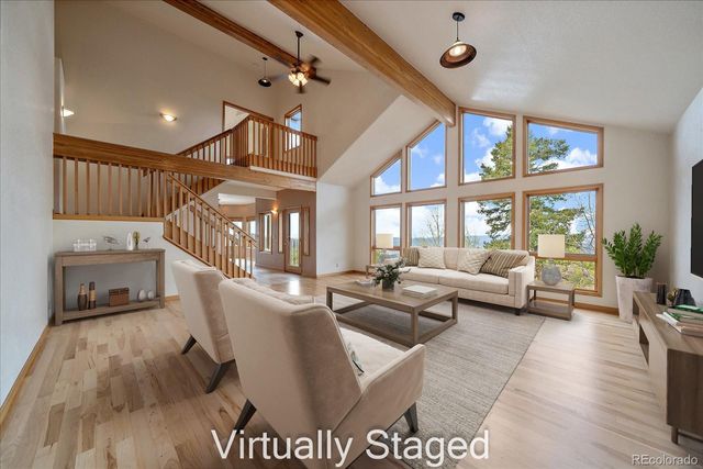 a view of an entryway with wooden floor