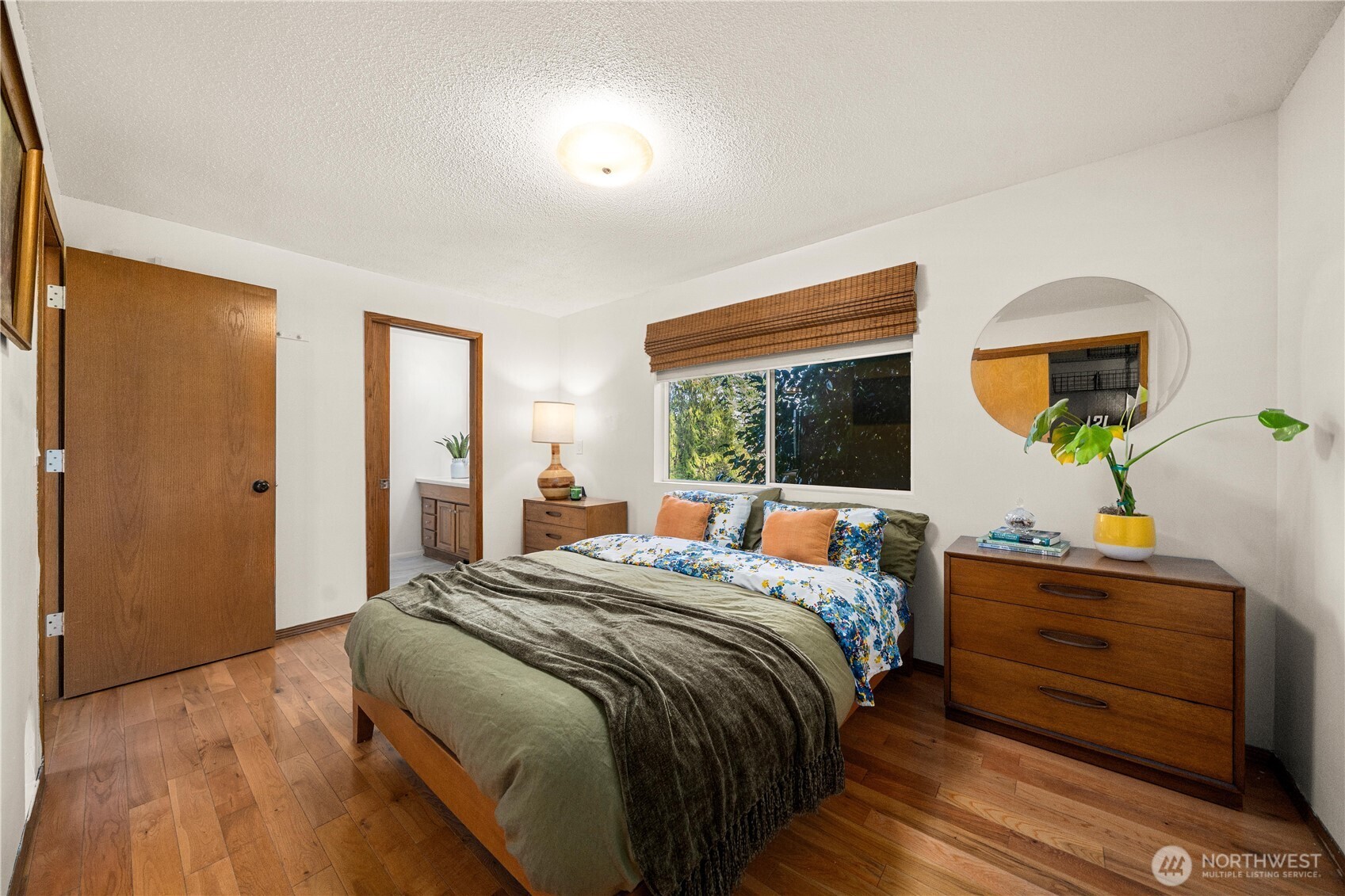 30024 2nd Avenue Southwest Federal Way, WA 98023 - Photo 16 of 40 a bed sitting in a bedroom next to a window