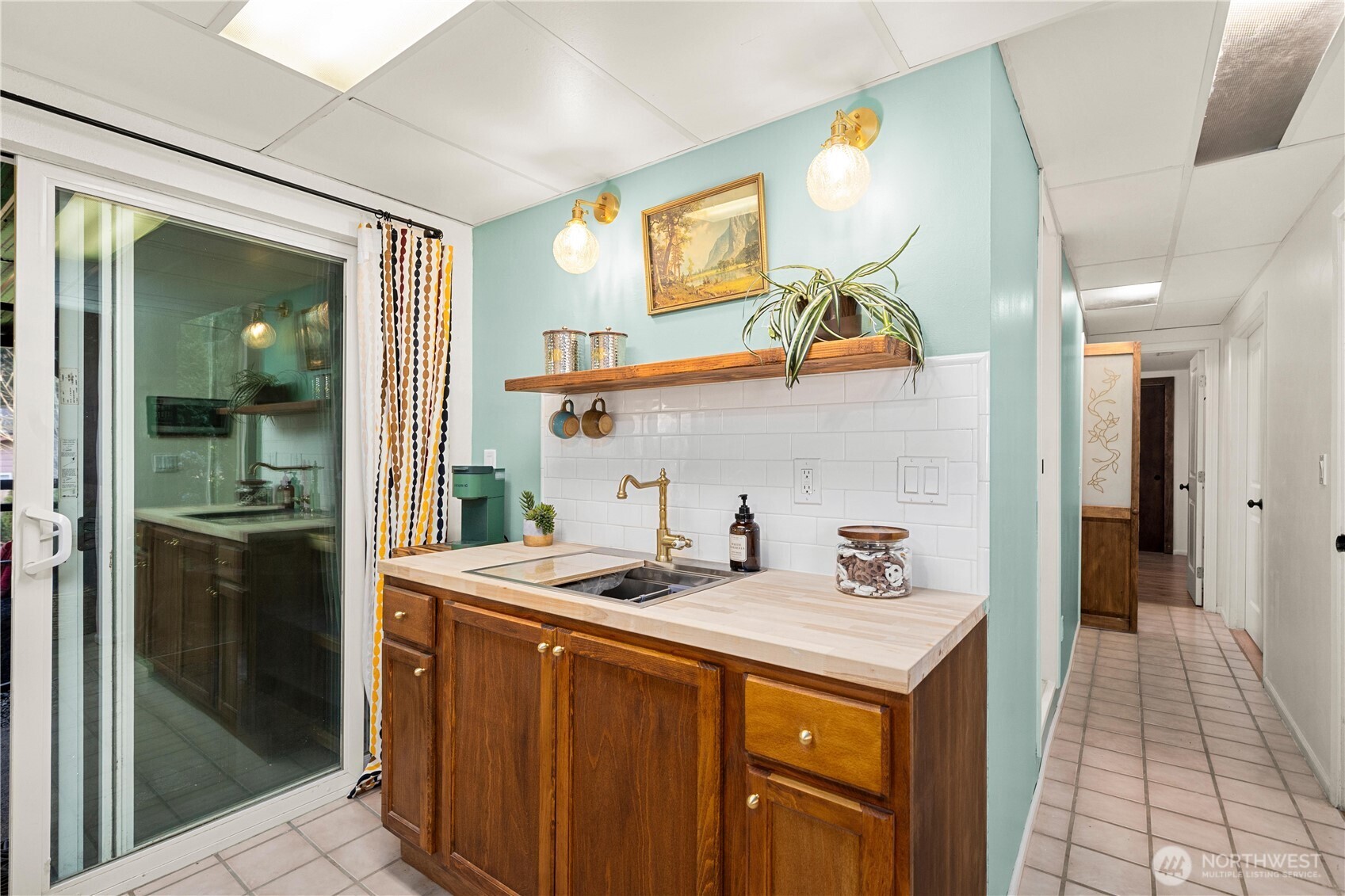 30024 2nd Avenue Southwest Federal Way, WA 98023 - Photo 24 of 40 a kitchen with a sink a refrigerator and cabinets