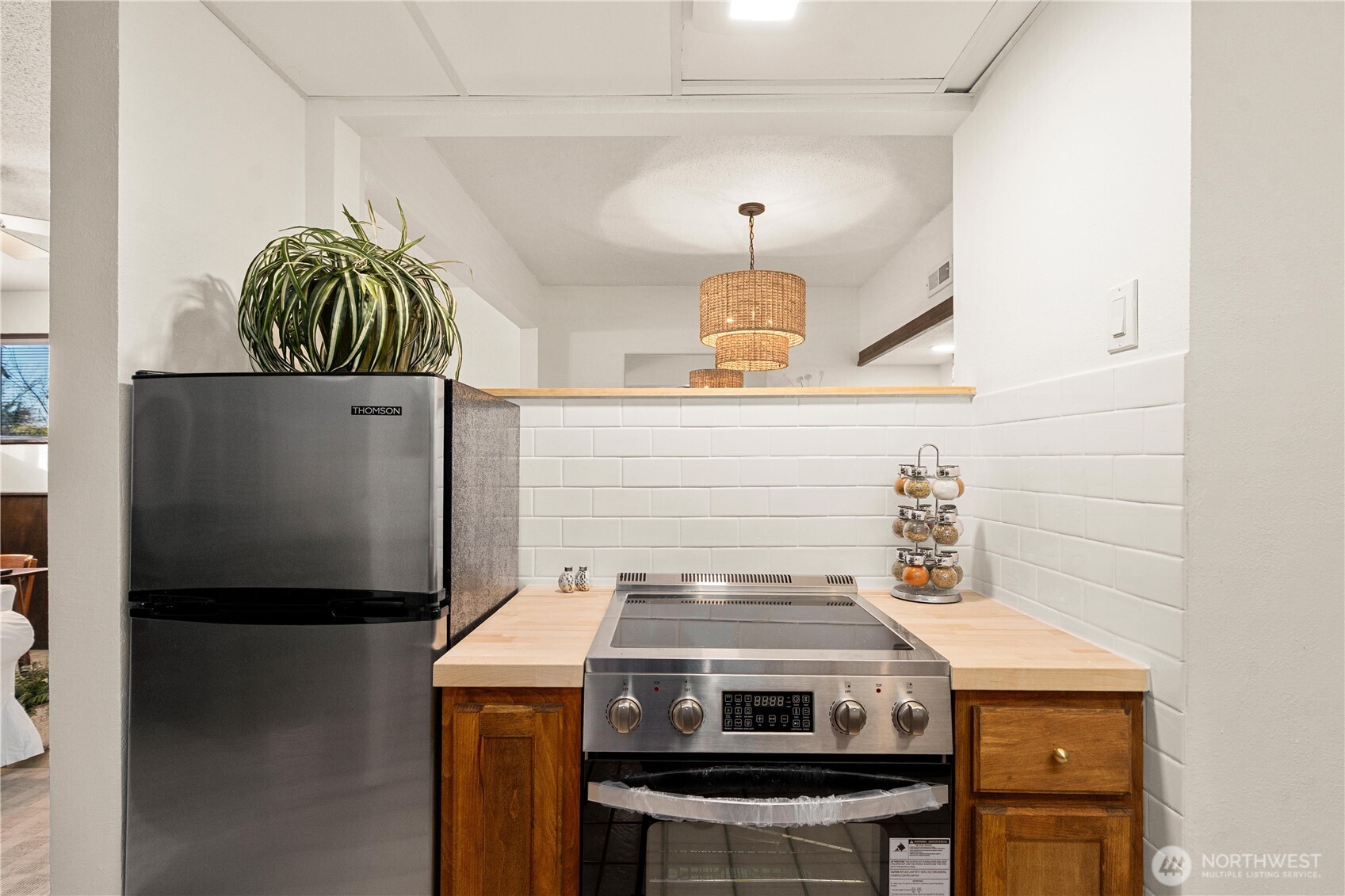 30024 2nd Avenue Southwest Federal Way, WA 98023 - Photo 25 of 40 a kitchen with a stove and a refrigerator