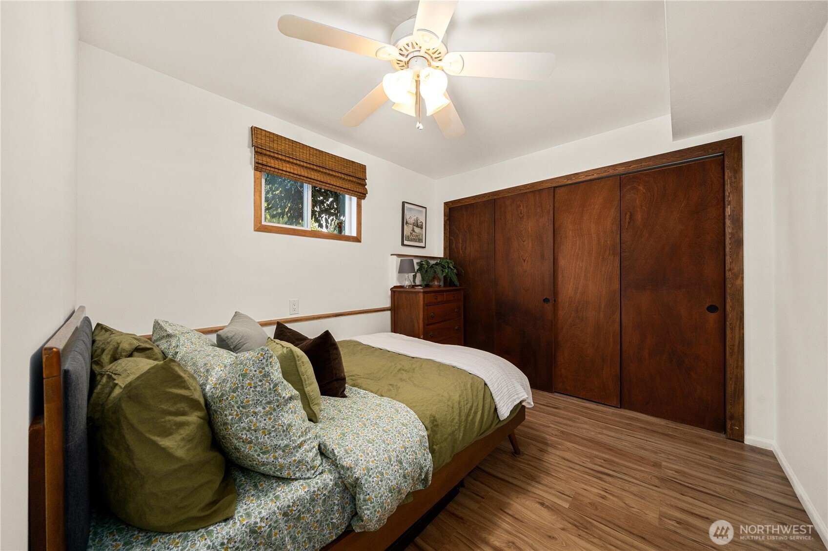 30024 2nd Avenue Southwest Federal Way, WA 98023 - Photo 29 of 40 a bedroom with a bed and a chandelier
