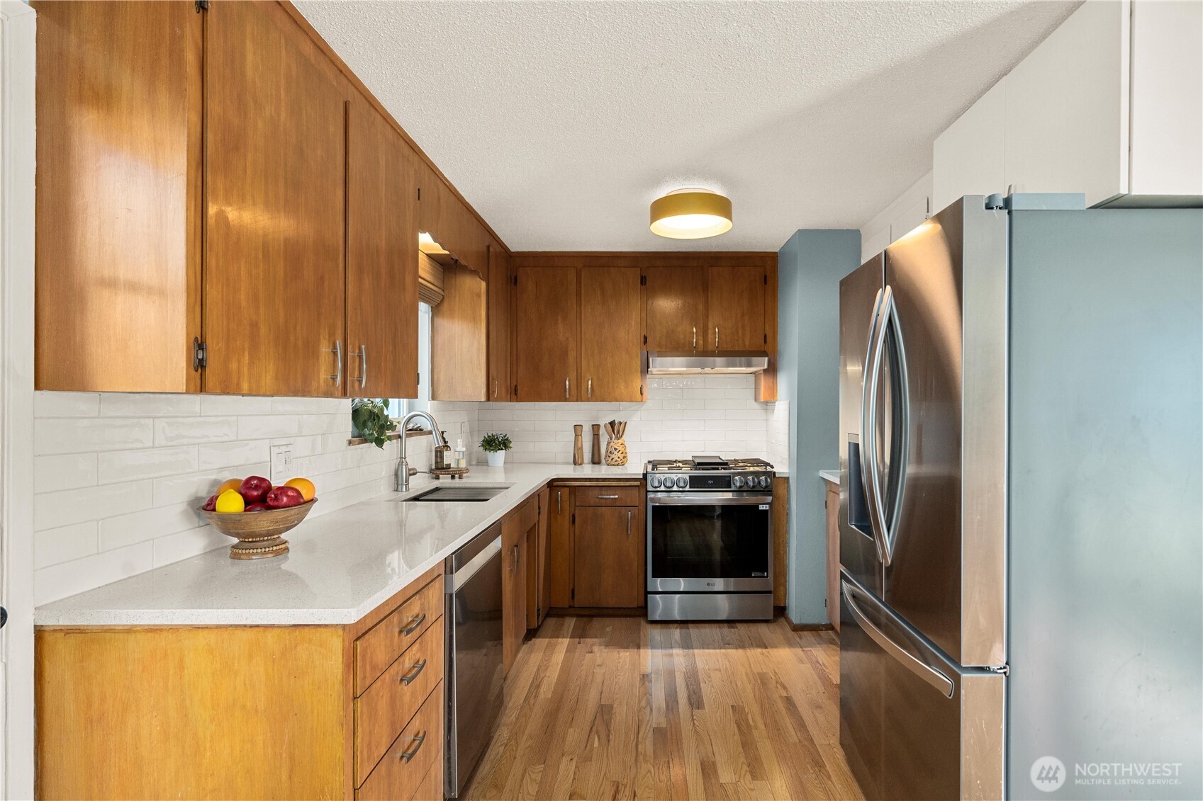 30024 2nd Avenue Southwest Federal Way, WA 98023 - Photo 7 of 40 a kitchen with stainless steel appliances granite countertop a sink stove and refrigerator