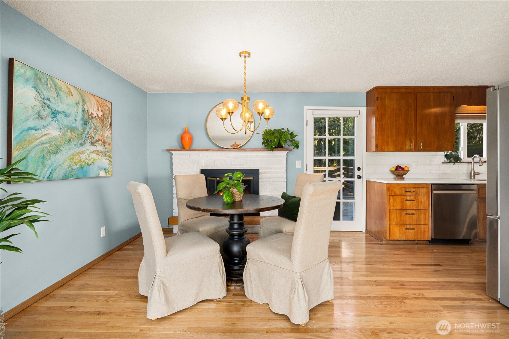 30024 2nd Avenue Southwest Federal Way, WA 98023 - Photo 9 of 40 a dining room with furniture a fireplace and wooden floor