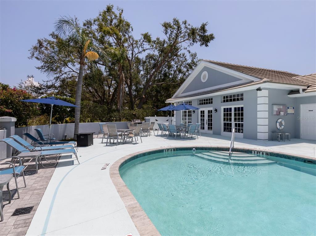 503 Clubside Circle, Unit 47 Venice, FL 34293 - Photo 34 of 83 a swimming pool with outdoor seating and yard