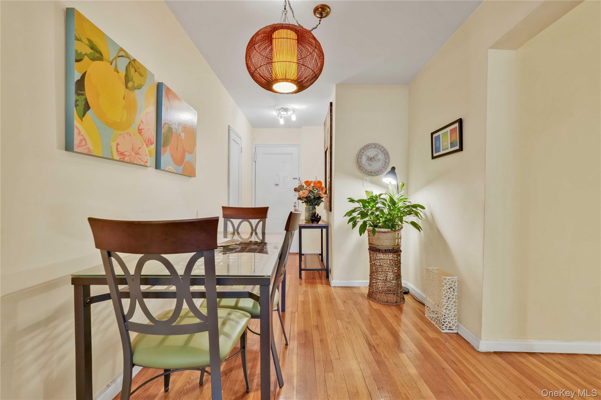 140-08 28th Road, Unit 1C Queens, NY 11354 - Photo 3 of 14 a view of a dining room with furniture and wooden floor