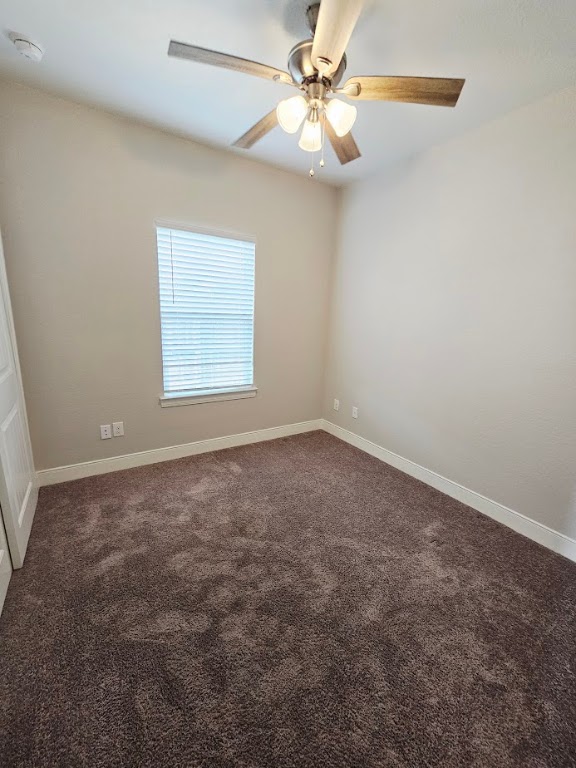 110 East Otto Street Marion, TX 78124 - Photo 11 of 14 an empty room with a window and a fan