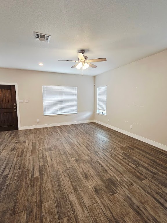 110 East Otto Street Marion, TX 78124 - Photo 2 of 14 a view of an empty room with wooden floor and a window