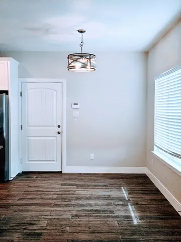 a view of room window and wooden floor