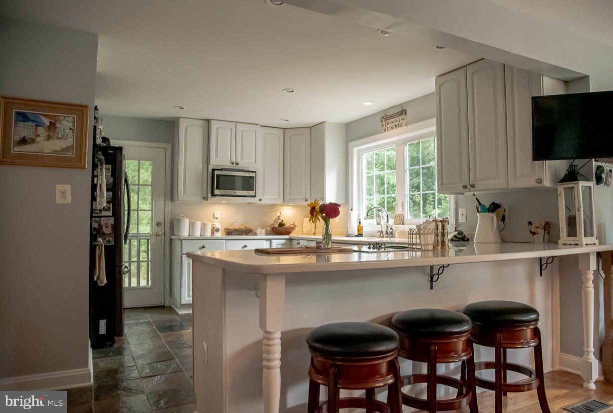 20814 Furr Road Round Hill, VA 20141 - Photo 7 of 41 Bright Eat in Kitchen with access to porch swing