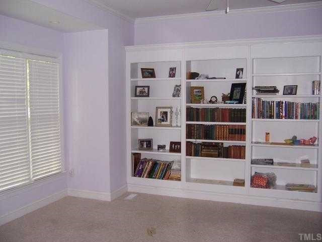 12708 Amoretto Way Raleigh, NC 27613 - Photo 4 of 12 Large formal living room or use as library if desire complete with book case. Living Room