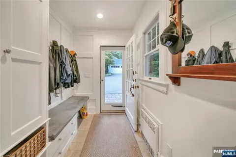 a bathroom with a sink a mirror and shower
