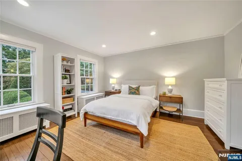 a bedroom with a bed and a table in it