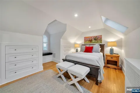 a bedroom with a bed and furniture