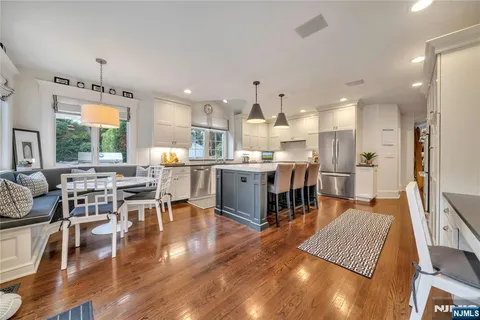 an open kitchen with a table and chairs