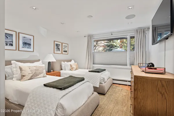 a living room with furniture window and a flat screen tv