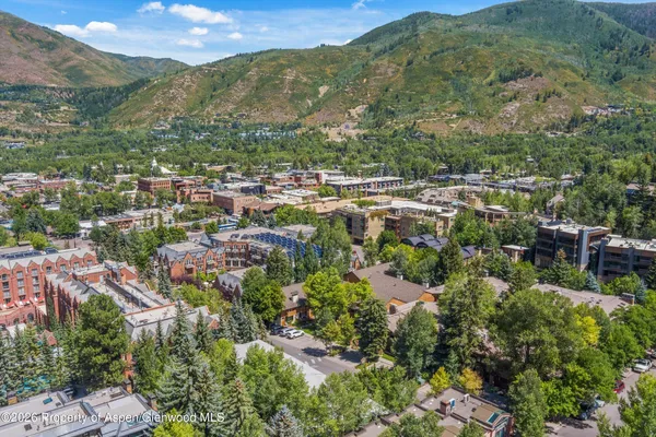 a view of a city with mountains in the background