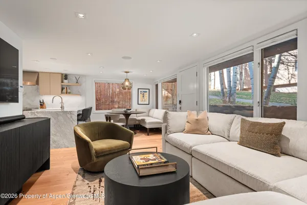 a living room with furniture and a large window