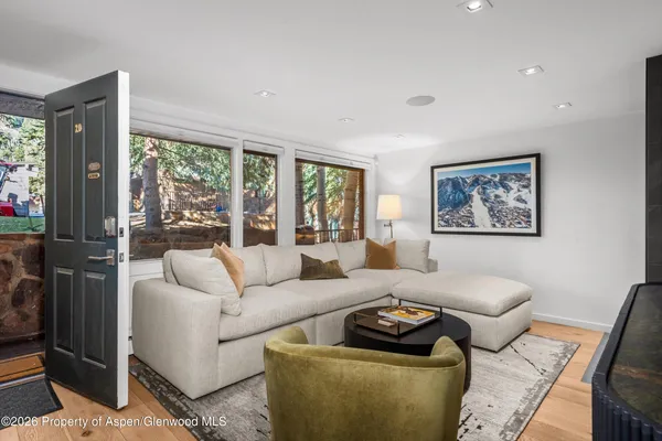 a living room with furniture and a large window
