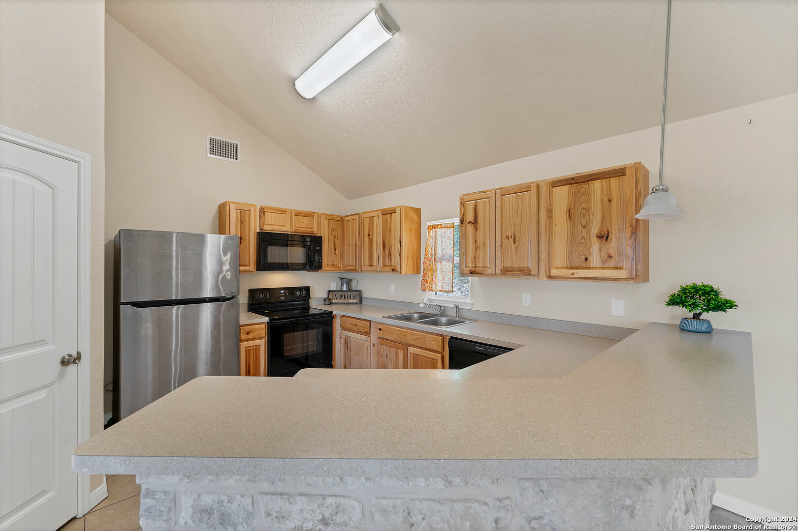 2407 Golf Drive Spring Branch, TX 78070 - Photo 11 of 29 a kitchen with a refrigerator and a sink