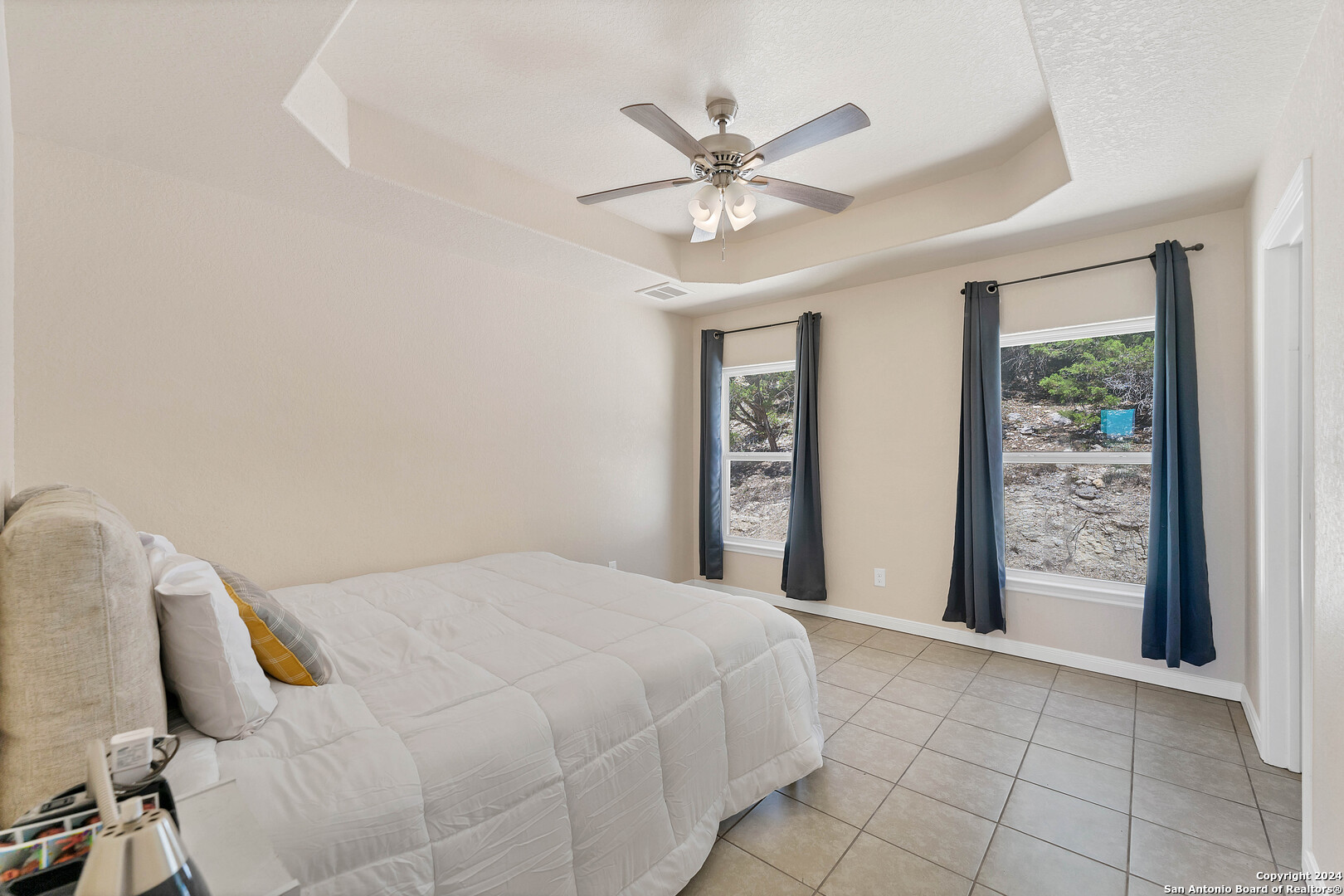 2407 Golf Drive Spring Branch, TX 78070 - Photo 13 of 29 a bedroom with a bed and a window