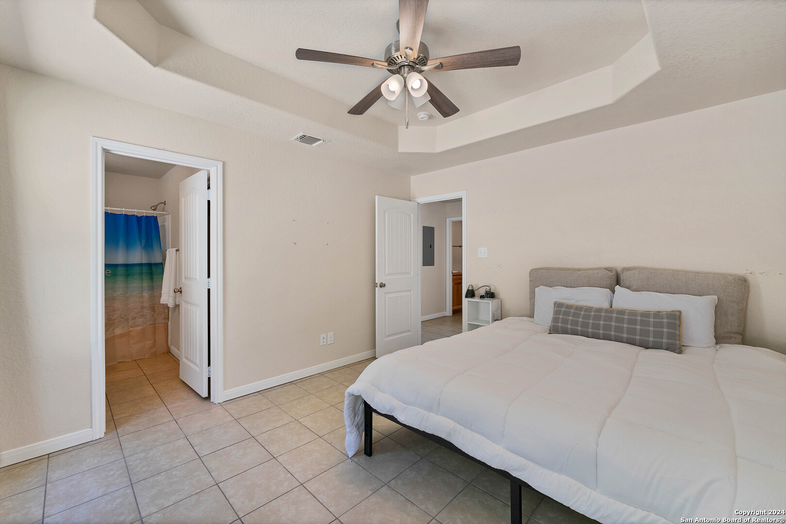 2407 Golf Drive Spring Branch, TX 78070 - Photo 14 of 29 a bedroom with a bed and a ceiling fan