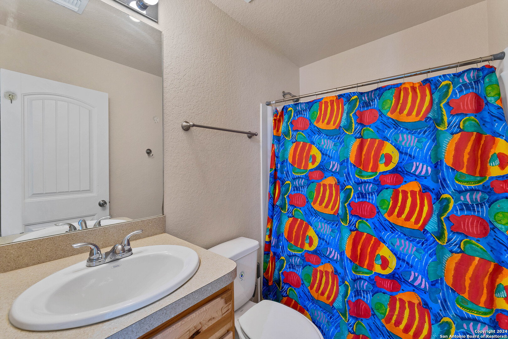 2407 Golf Drive Spring Branch, TX 78070 - Photo 18 of 29 a bathroom with a sink and a toilet