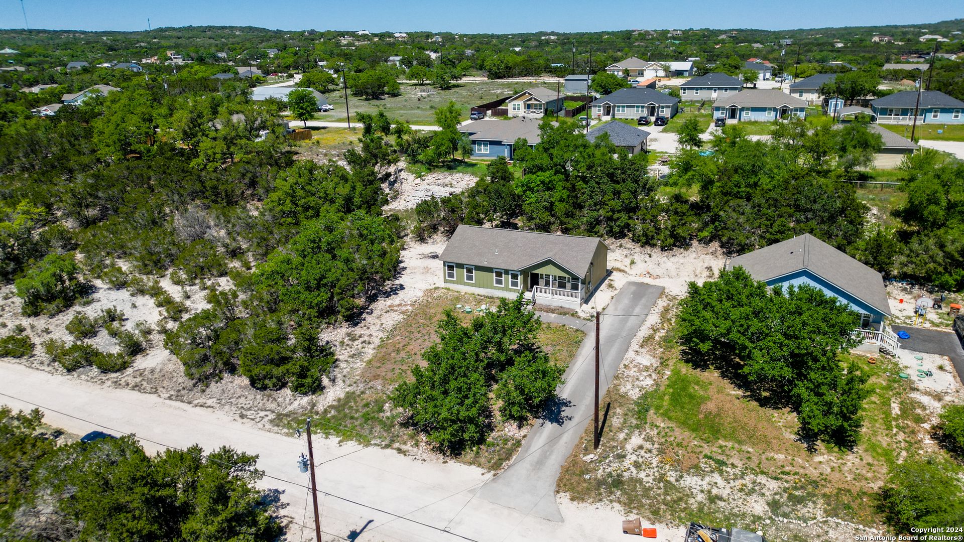 2407 Golf Drive Spring Branch, TX 78070 - Photo 23 of 29 an aerial view of residential houses with outdoor space and trees