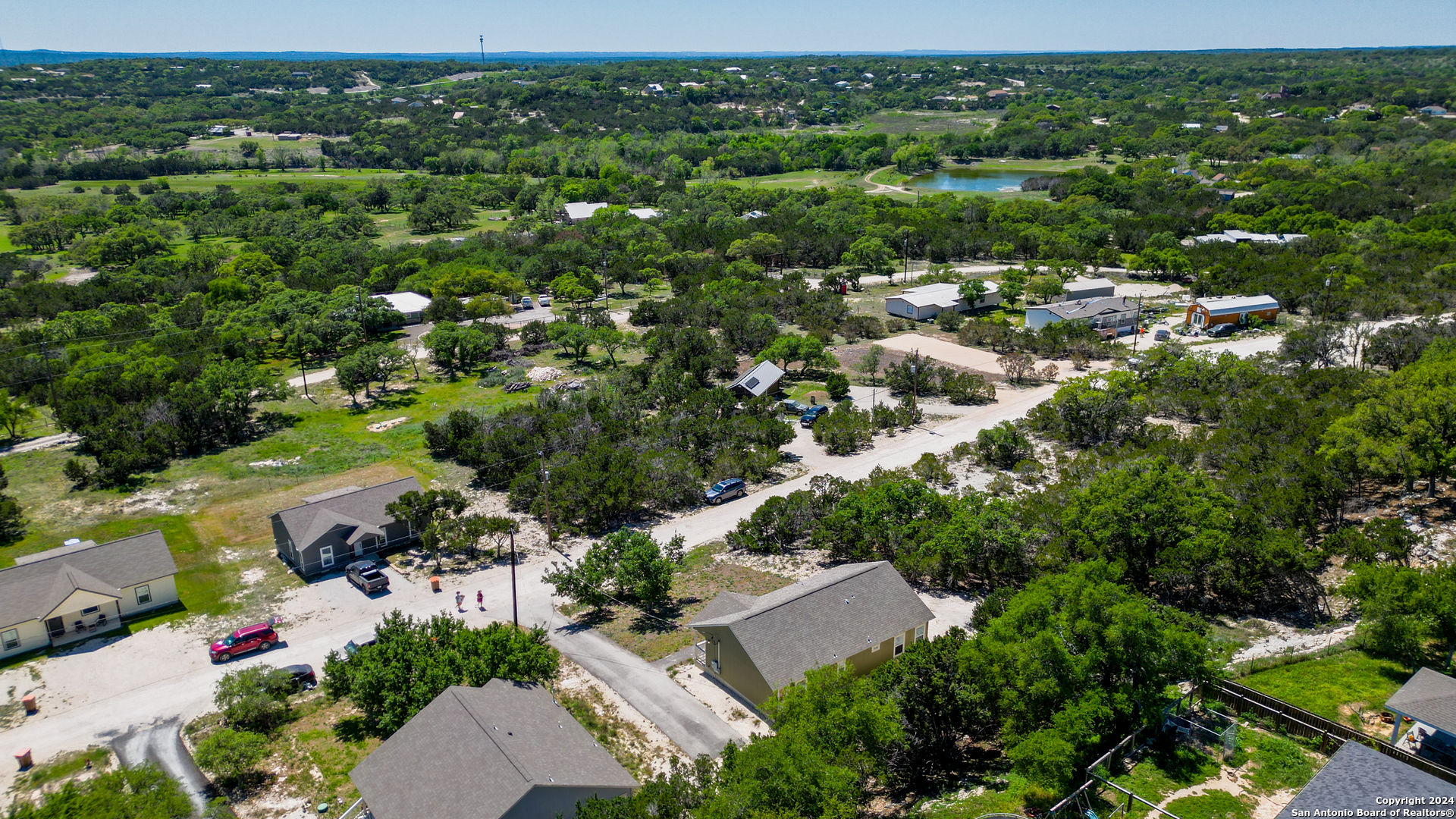 2407 Golf Drive Spring Branch, TX 78070 - Photo 25 of 29 an aerial view of residential houses with outdoor space and trees