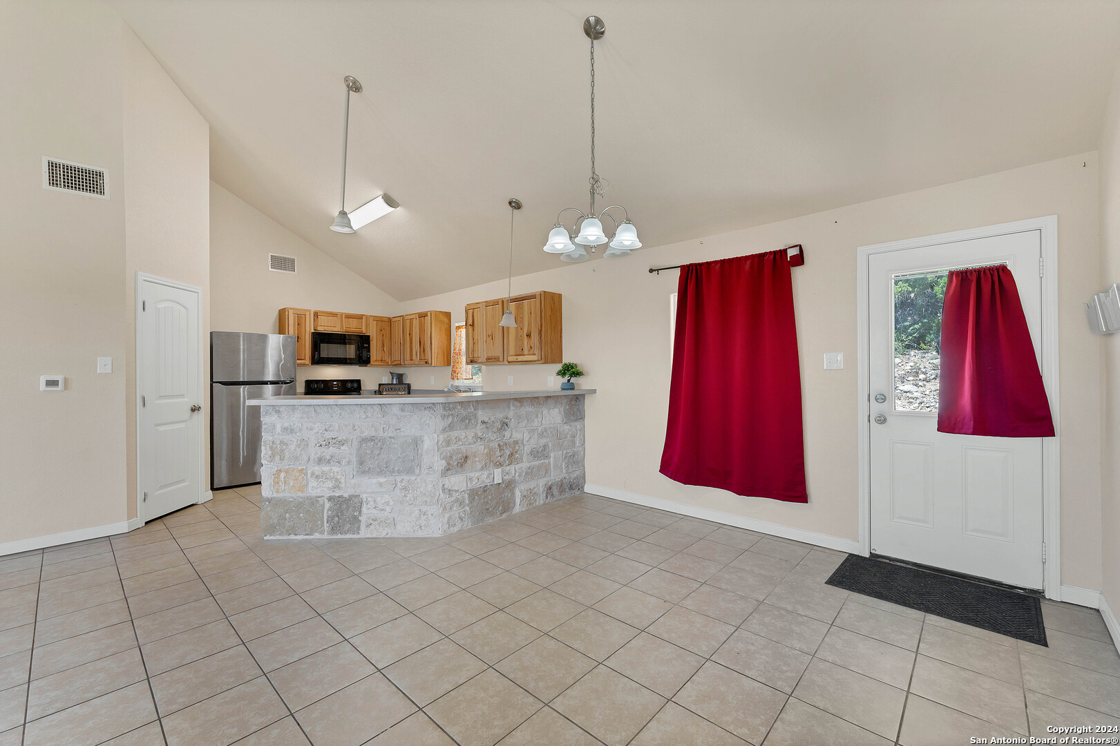 2407 Golf Drive Spring Branch, TX 78070 - Photo 5 of 29 a view of a kitchen with stainless steel appliances granite countertop a stove top oven a refrigerator a sink and dishwasher