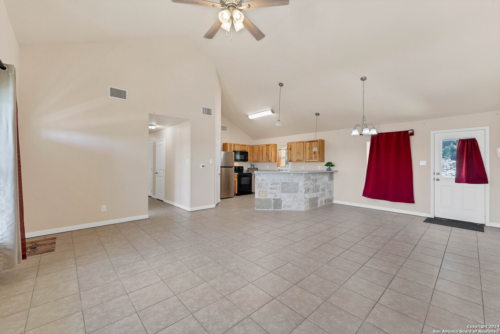 2407 Golf Drive Spring Branch, TX 78070 - Photo 6 of 29 a view of a kitchen with furniture and a chandelier fan