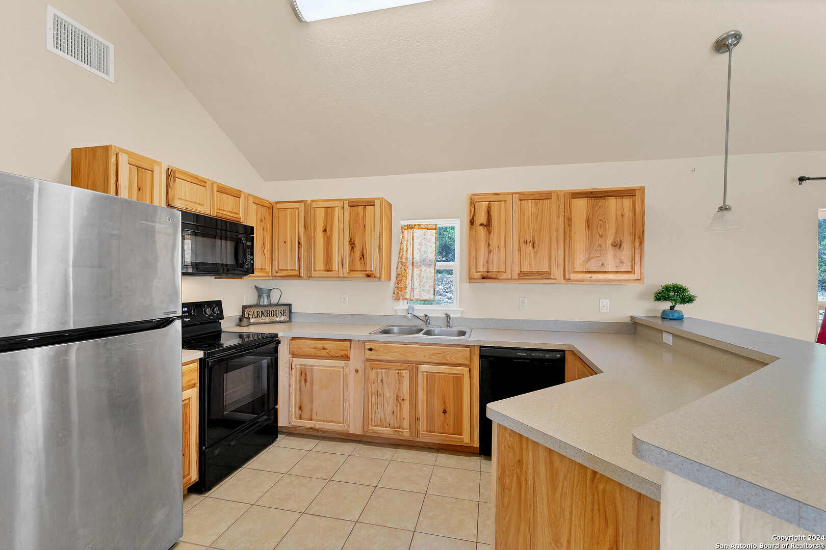 2407 Golf Drive Spring Branch, TX 78070 - Photo 10 of 29 a kitchen with a sink a stove and refrigerator