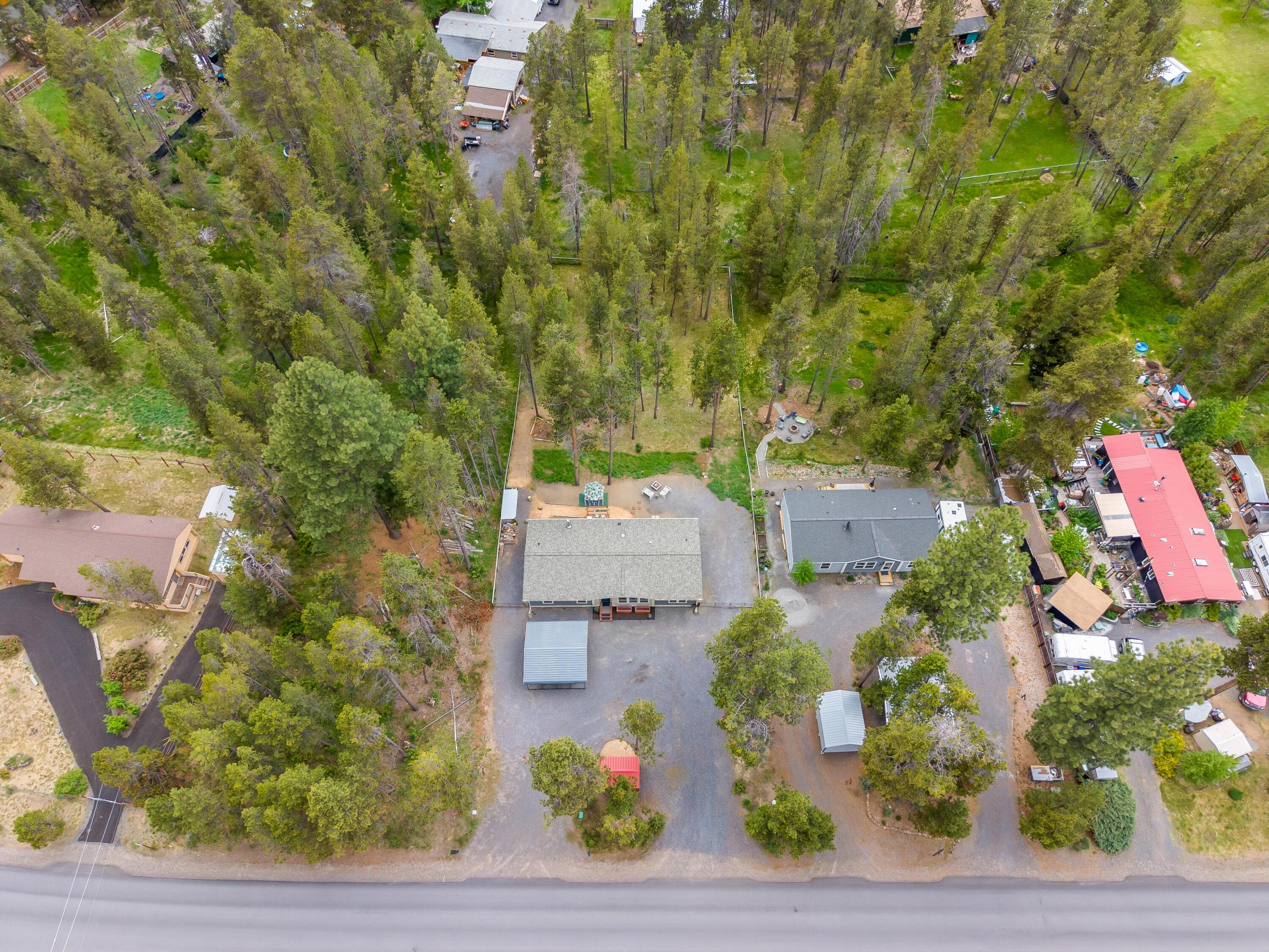 55823 Snow Goose Road Bend, OR 97707 - Photo 34 of 36 an aerial view of a house with a yard