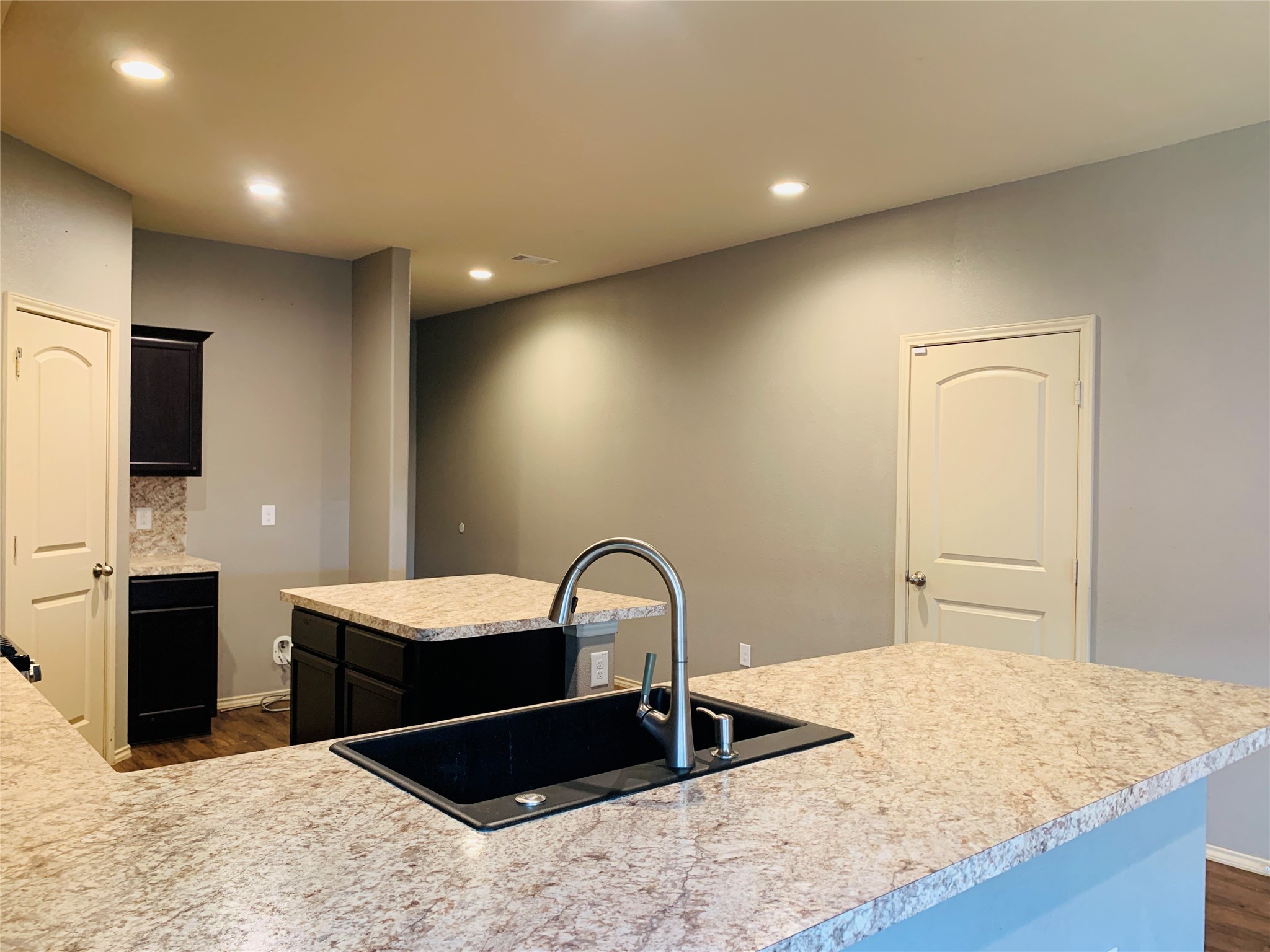 15438 Rancho Joya Way Houston, TX 77049 - Photo 9 of 31 a kitchen with a refrigerator and a sink