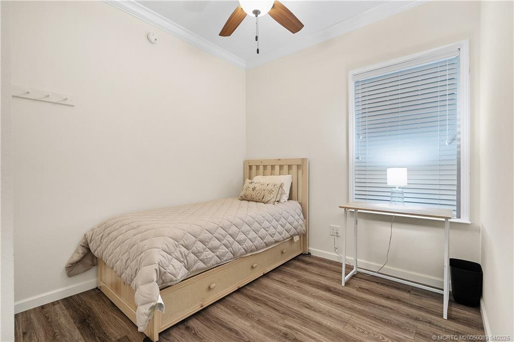 4800 Southeast Federal Highway, Unit 34 Stuart, FL 34997 - Photo 17 of 47 a bedroom with a bed and a window