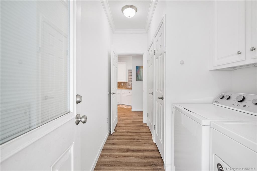 4800 Southeast Federal Highway, Unit 34 Stuart, FL 34997 - Photo 22 of 47 a view of a hallway with wooden floor and staircase