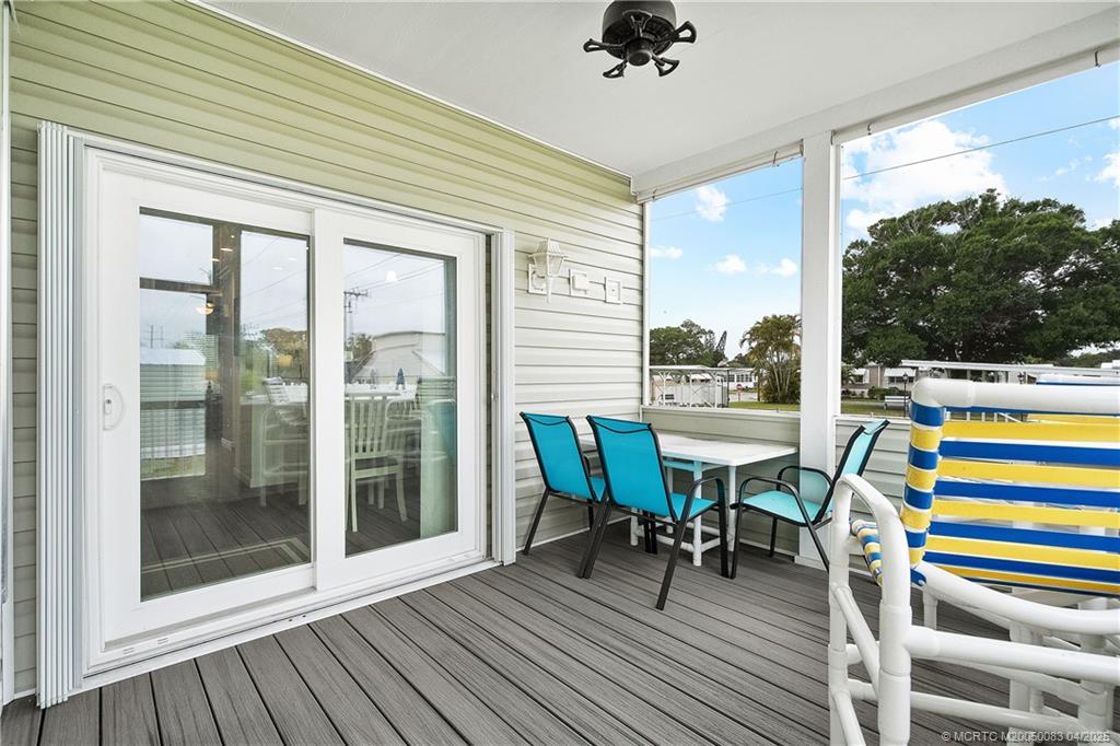 4800 Southeast Federal Highway, Unit 34 Stuart, FL 34997 - Photo 24 of 47 a view of a dining table and chairs in balcony