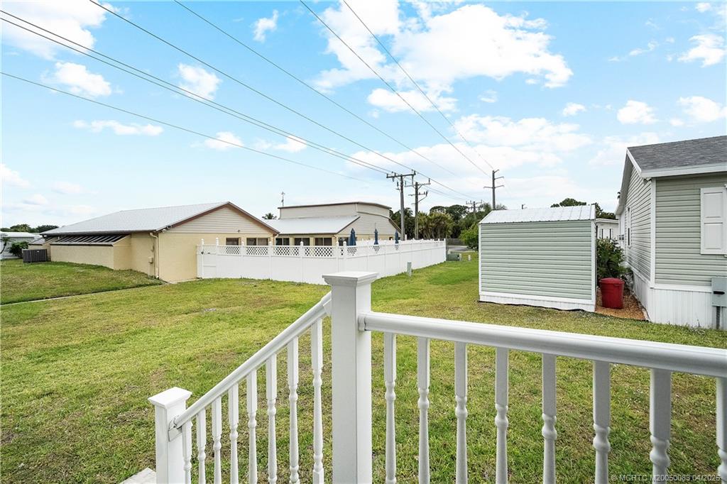 4800 Southeast Federal Highway, Unit 34 Stuart, FL 34997 - Photo 25 of 47 a view of a house with wooden fence