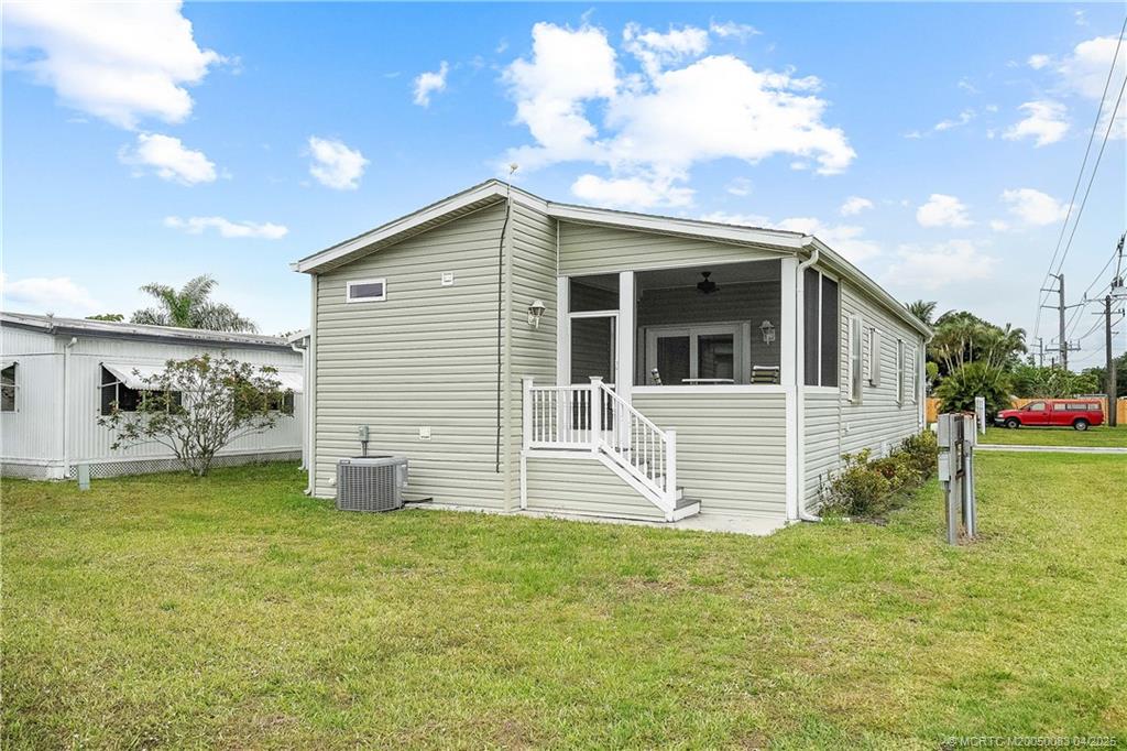 4800 Southeast Federal Highway, Unit 34 Stuart, FL 34997 - Photo 26 of 47 a view of a house with a yard