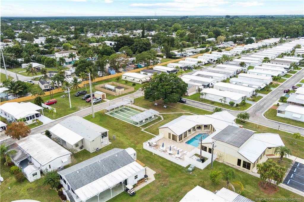 4800 Southeast Federal Highway, Unit 34 Stuart, FL 34997 - Photo 33 of 47 an aerial view of residential houses with outdoor space