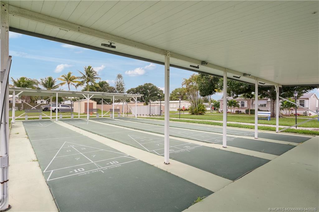 4800 Southeast Federal Highway, Unit 34 Stuart, FL 34997 - Photo 46 of 47 a view of a swimming pool and outdoor space