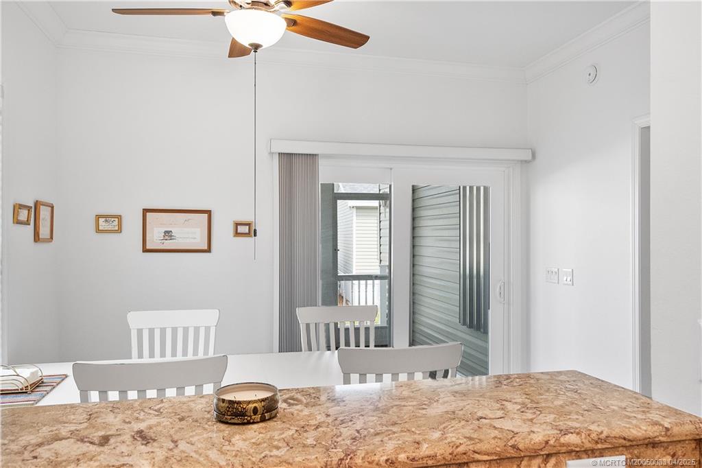 4800 Southeast Federal Highway, Unit 34 Stuart, FL 34997 - Photo 10 of 47 a bedroom with a bed and wooden floor