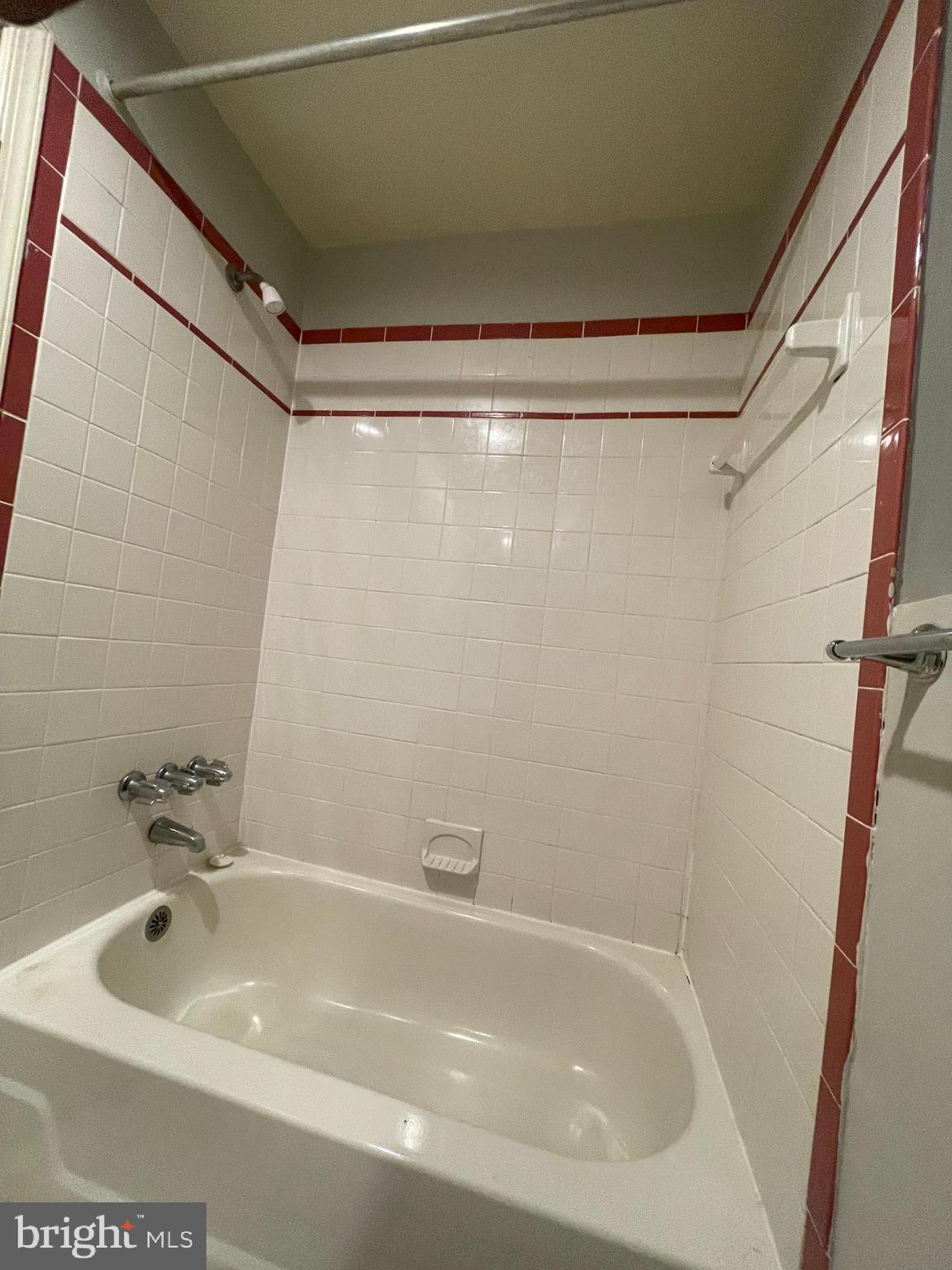 1820 Swann Street Northwest, Unit 101 Washington, DC 20009 - Photo 14 of 15 a bathroom with a tub and shower