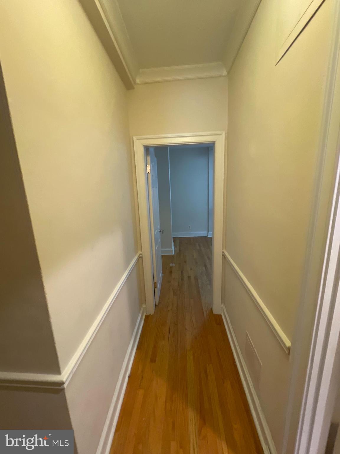 1820 Swann Street Northwest, Unit 101 Washington, DC 20009 - Photo 3 of 15 a view of hallway with wooden floor