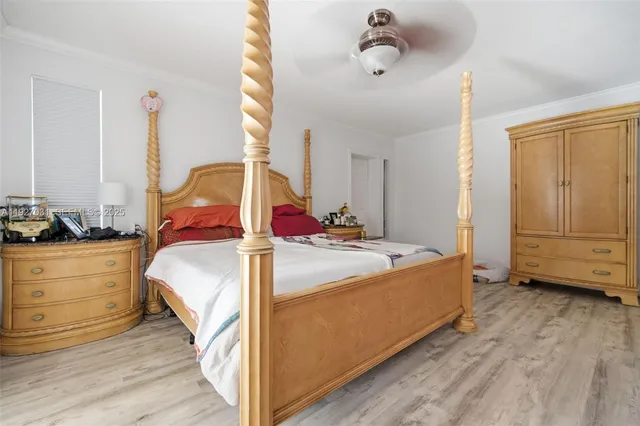 a bed room with a bed and a window