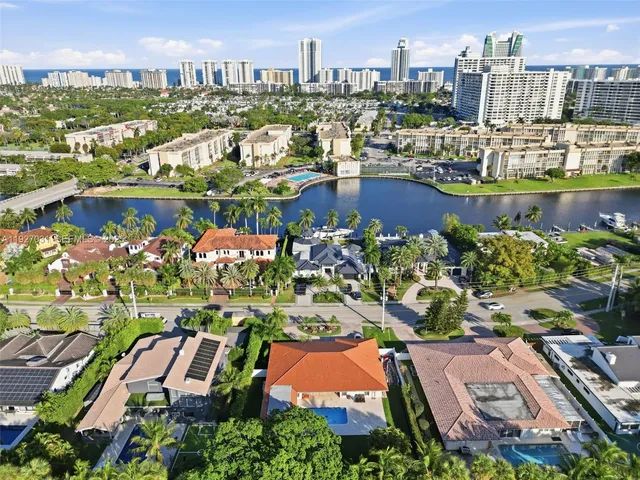 an aerial view of residential building and lake